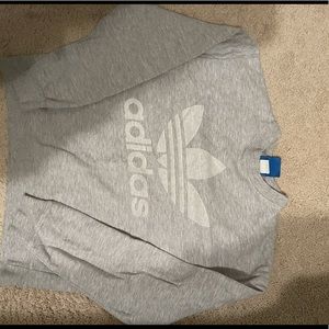 Grey adidas graphic sweatshirt. Logo on front and back.